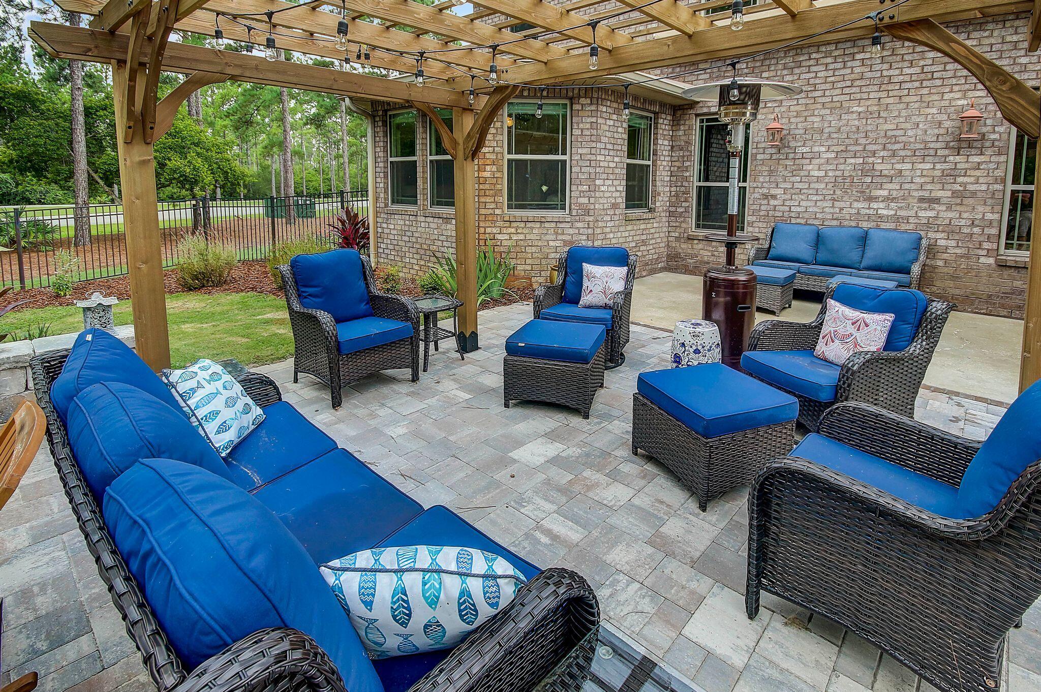 28 Haven Way Freeport, FL 32439 - Photo 37 of 50 a outdoor living space with patio furniture and a fireplace