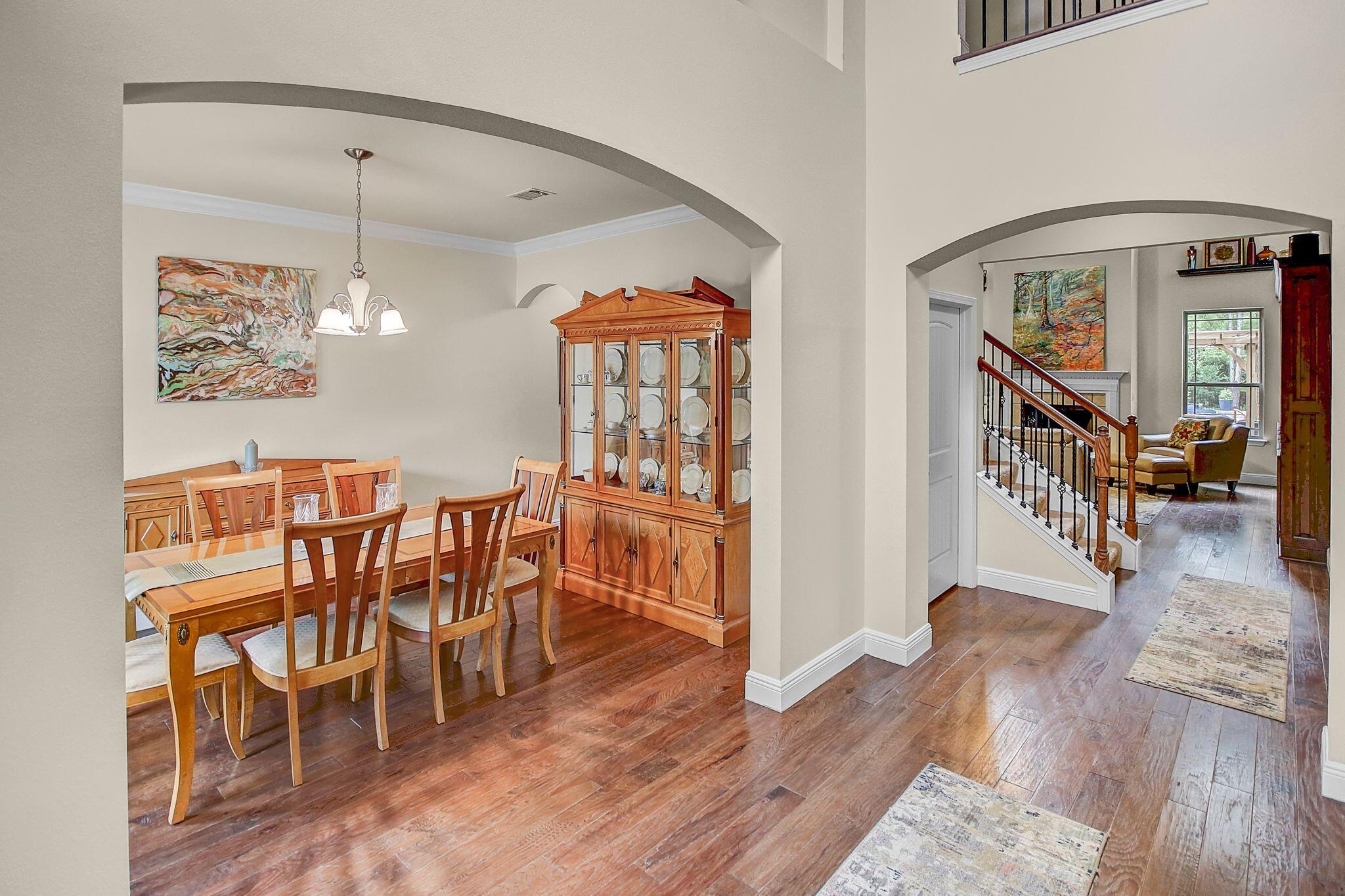 28 Haven Way Freeport, FL 32439 - Photo 4 of 50 a dining room with furniture a chandelier and wooden floor