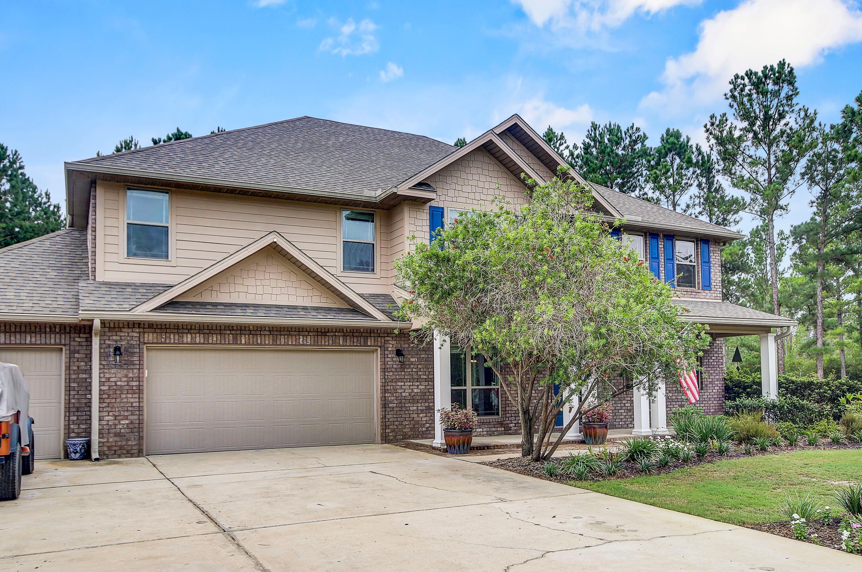 28 Haven Way Freeport, FL 32439 - Photo 44 of 50 a front view of a house with a garden