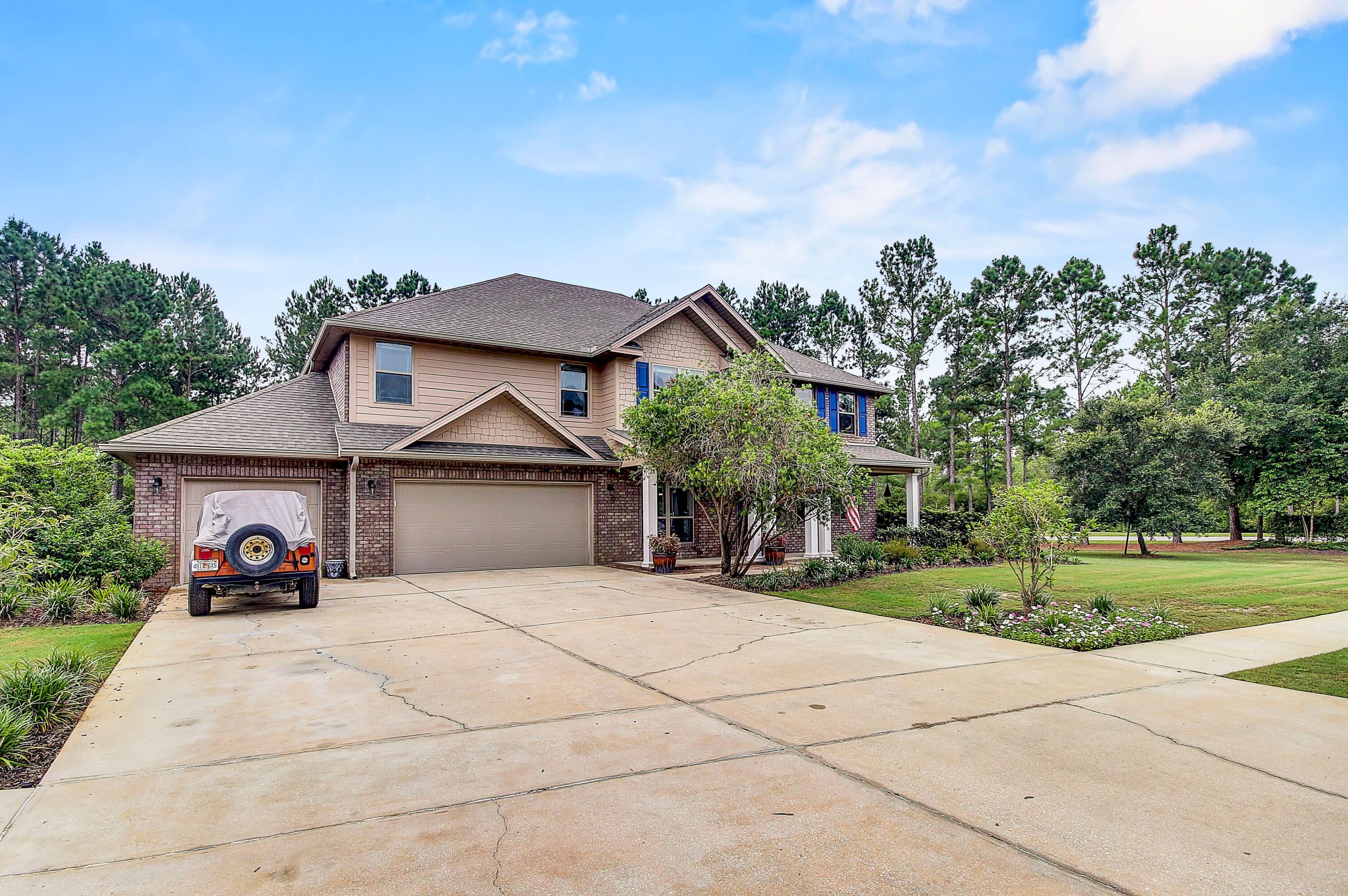 28 Haven Way Freeport, FL 32439 - Photo 45 of 50 a front view of a house with a yard and potted plants