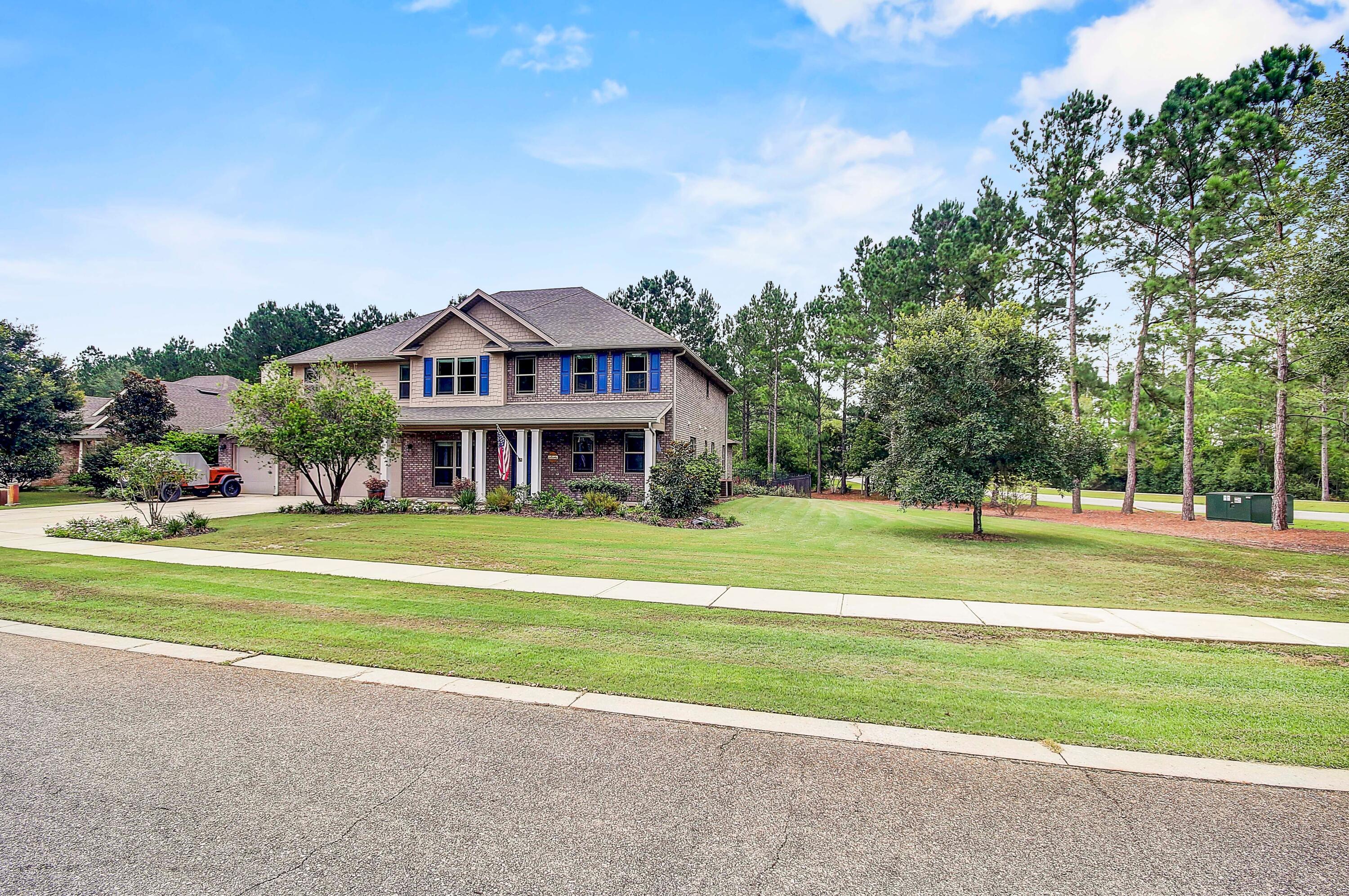 28 Haven Way Freeport, FL 32439 - Photo 46 of 50 a view of a big house with a big yard and large trees
