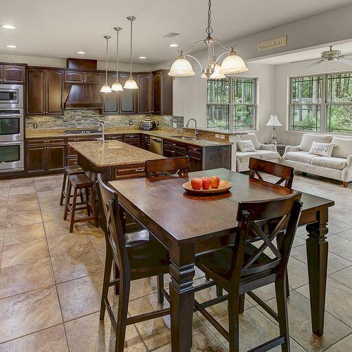 28 Haven Way Freeport, FL 32439 - Photo 9 of 50 a kitchen with a dining table and chairs