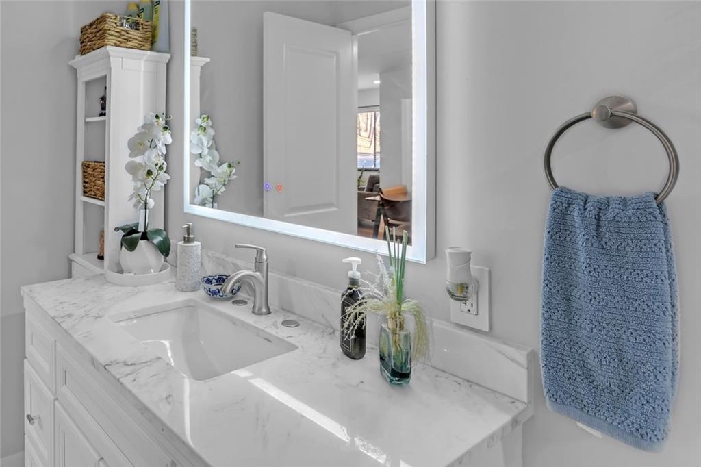 1211 Wingate Way Atlanta, GA 30350 - Photo 21 of 37 a bathroom with a sink and a mirror