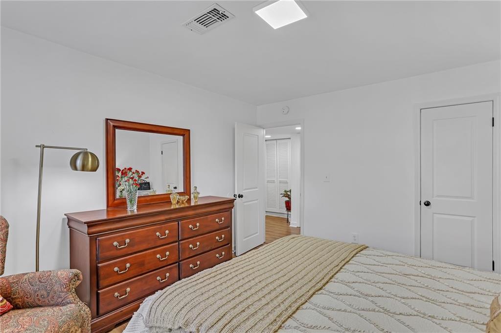 1211 Wingate Way Atlanta, GA 30350 - Photo 24 of 37 a bedroom with a bed and a dresser
