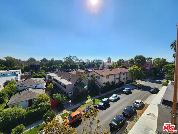an aerial view of a house with a garden