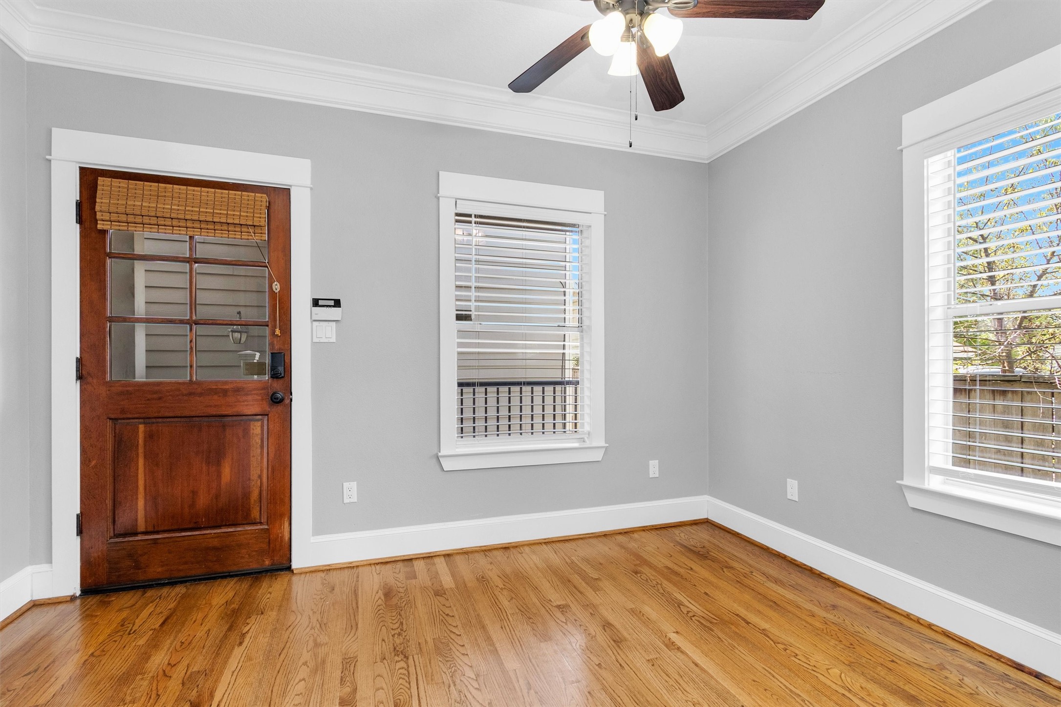 304 Vincent Street Houston, TX 77009 - Photo 14 of 36 a view of an empty room with a window and wooden floor