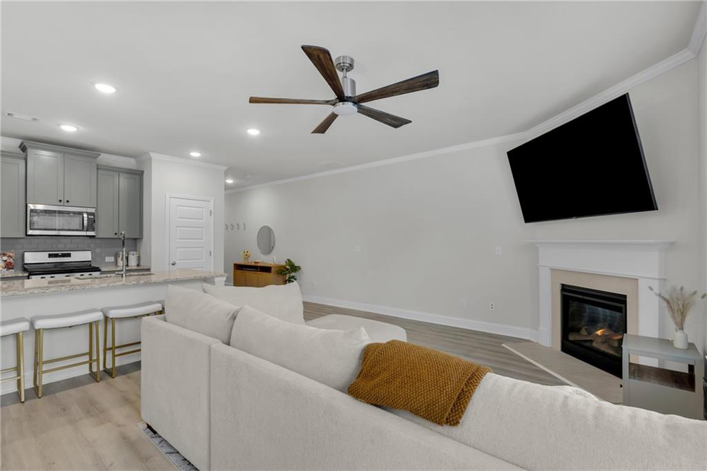 6710 Cedar Glen Road Atlanta, GA 30360 - Photo 14 of 35 a living room with furniture and a fireplace