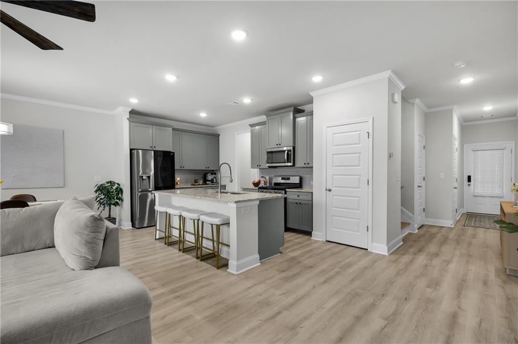 6710 Cedar Glen Road Atlanta, GA 30360 - Photo 16 of 35 a large white kitchen with a large window a refrigerator and a sink