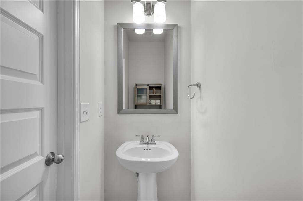 6710 Cedar Glen Road Atlanta, GA 30360 - Photo 17 of 35 a bathroom with a sink and a mirror