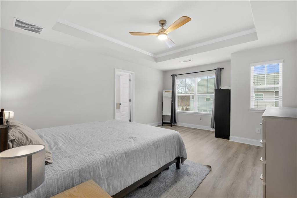 6710 Cedar Glen Road Atlanta, GA 30360 - Photo 20 of 35 a bedroom with a bed and a large window