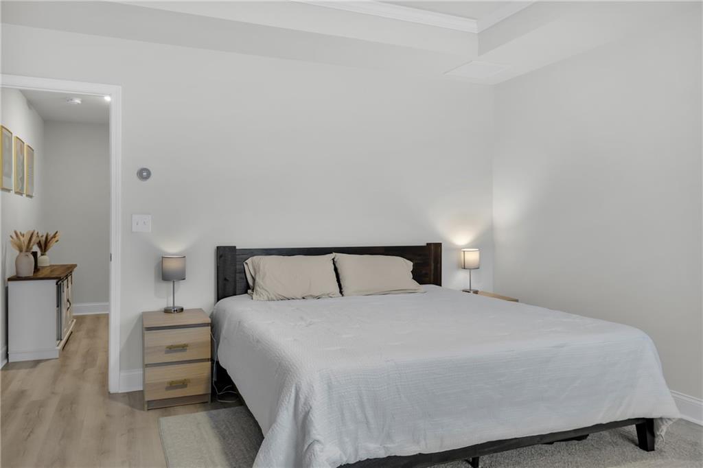 6710 Cedar Glen Road Atlanta, GA 30360 - Photo 21 of 35 a bedroom with a bed and a night stand