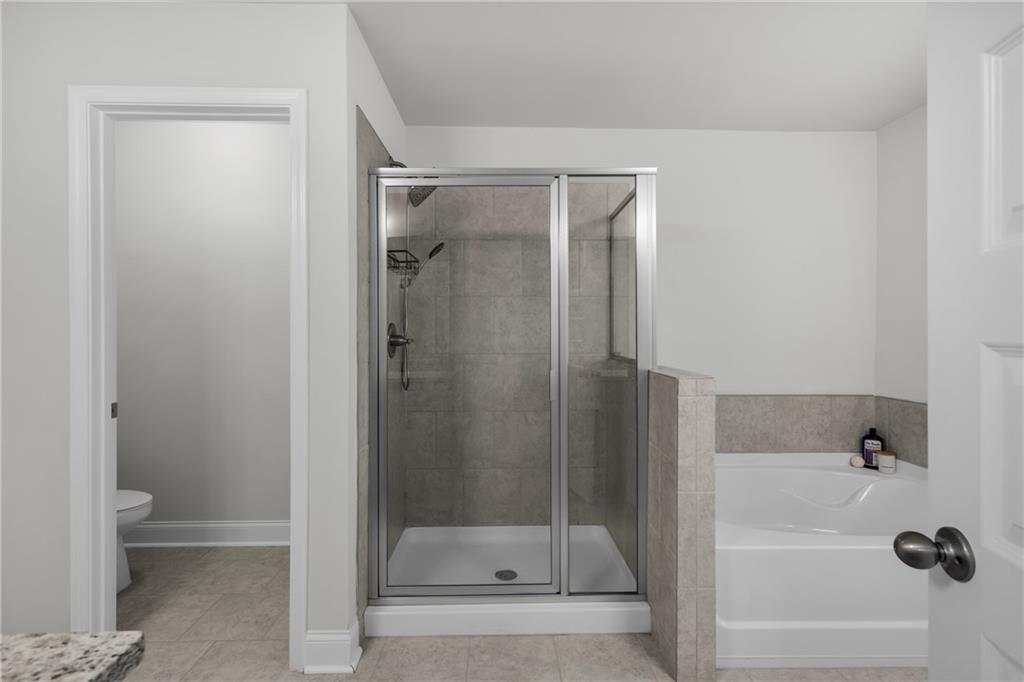 6710 Cedar Glen Road Atlanta, GA 30360 - Photo 24 of 35 a bathroom with a shower and a toilet