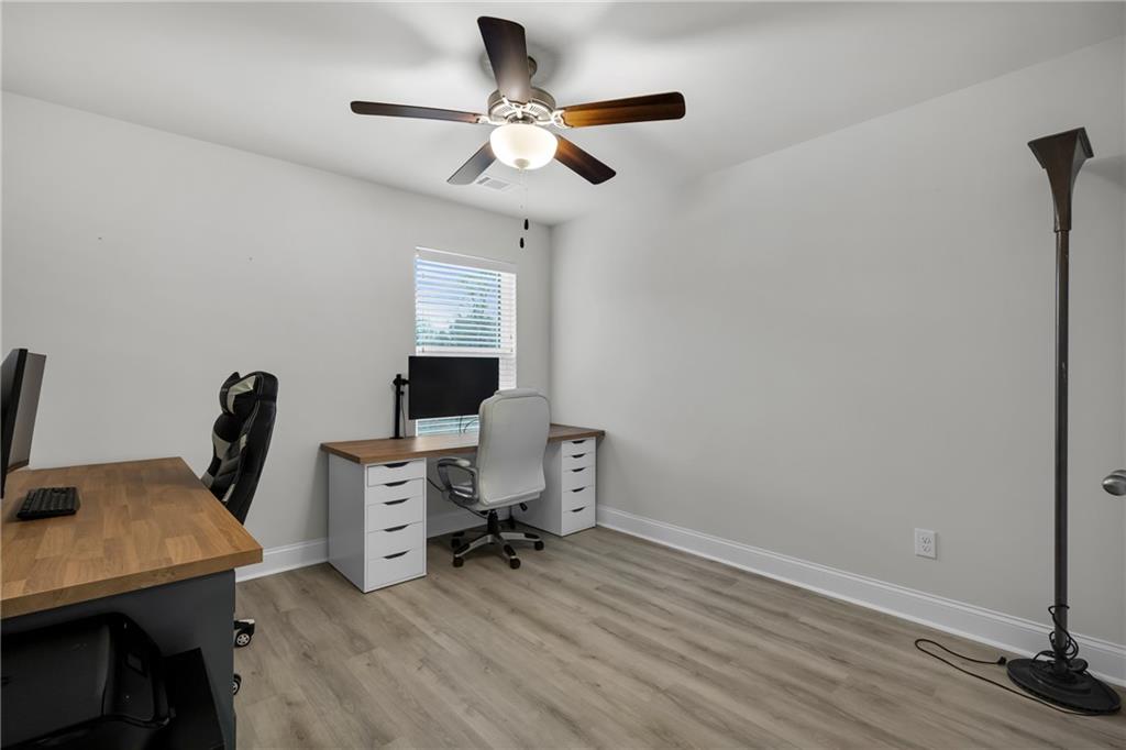 6710 Cedar Glen Road Atlanta, GA 30360 - Photo 31 of 35 a view of a workspace with furniture and a window