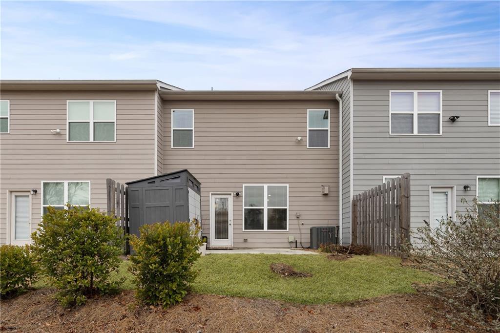 6710 Cedar Glen Road Atlanta, GA 30360 - Photo 35 of 35 a front view of a house with a yard and garage