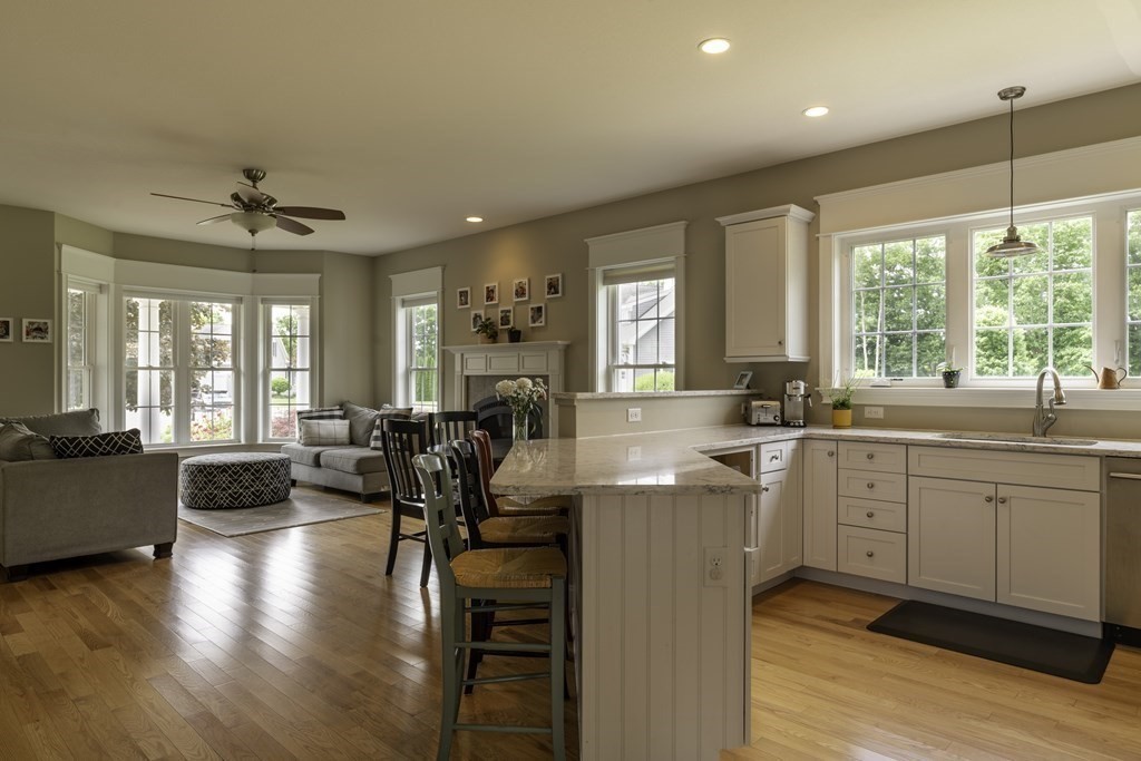 2 Chatham Way South Hadley, MA 01075 - Photo 12 of 40 a large open kitchen with a large window and stainless steel appliances