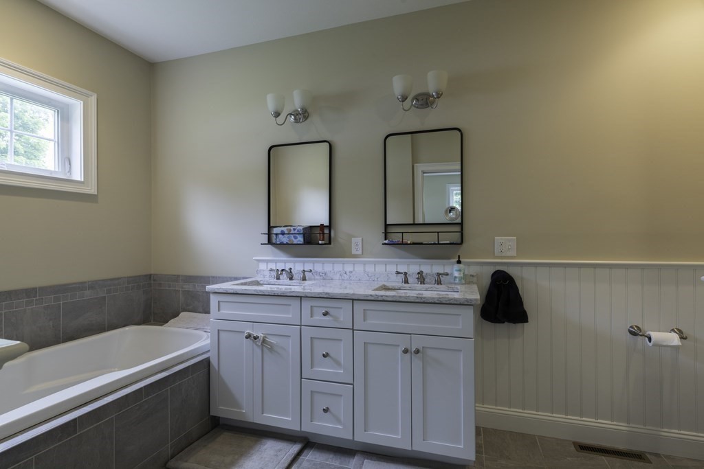 2 Chatham Way South Hadley, MA 01075 - Photo 17 of 40 a bathroom with a double vanity sink and mirror with bathtub