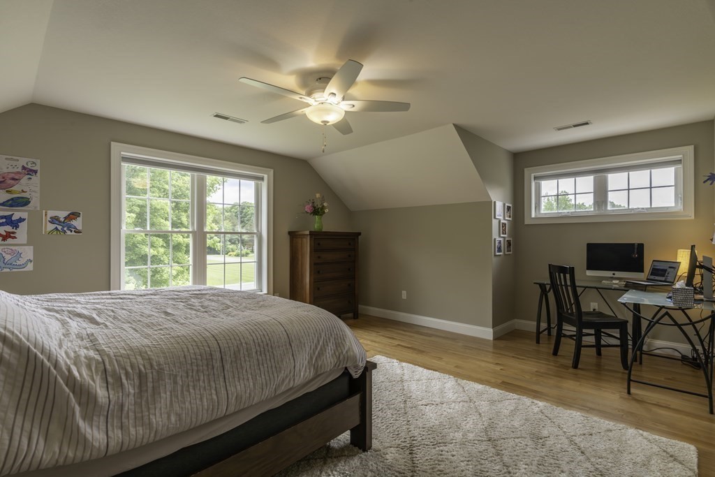 2 Chatham Way South Hadley, MA 01075 - Photo 23 of 40 a bedroom with a bed and a chandelier
