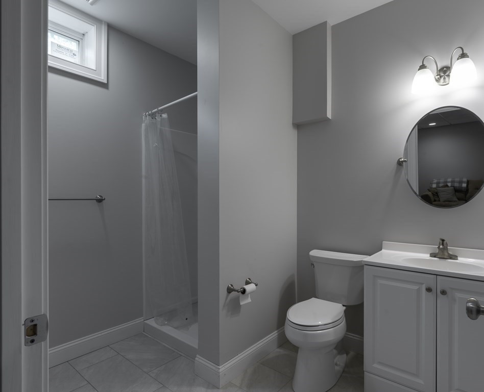 2 Chatham Way South Hadley, MA 01075 - Photo 30 of 40 a white toilet sitting next to a bathroom sink