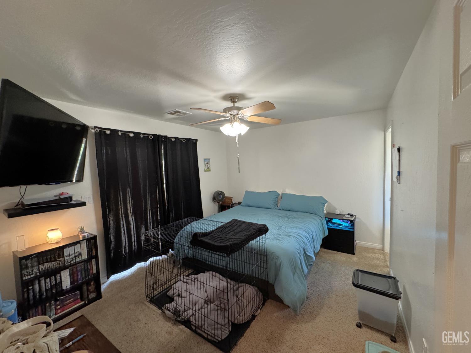 Undisclosed Address Tehachapi, CA 93561 - Photo 12 of 16 a living room with furniture and a flat screen tv