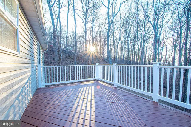 a view of balcony with wooden floor