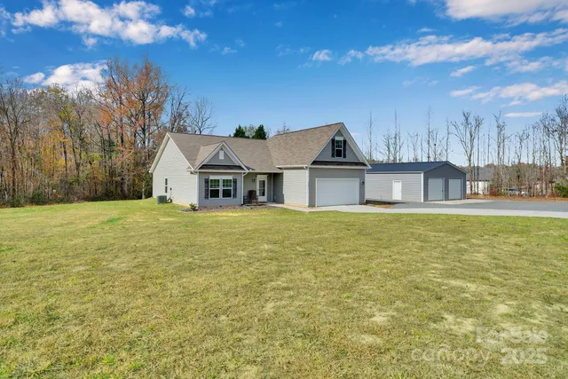 a house with swimming pool in front of it