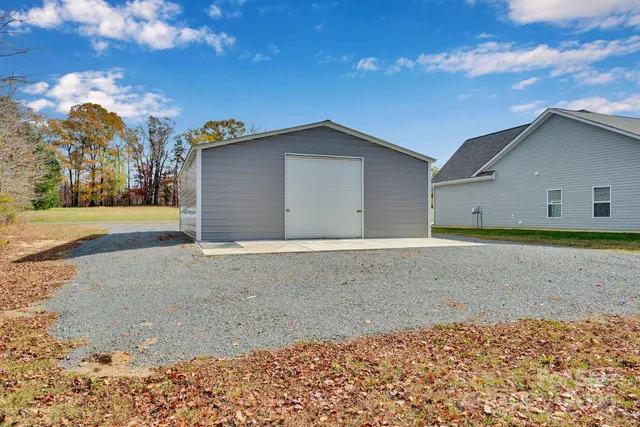 a view of a backyard of the house