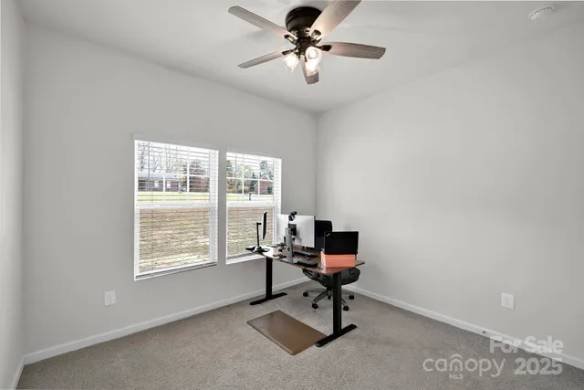 a workspace with furniture and a window