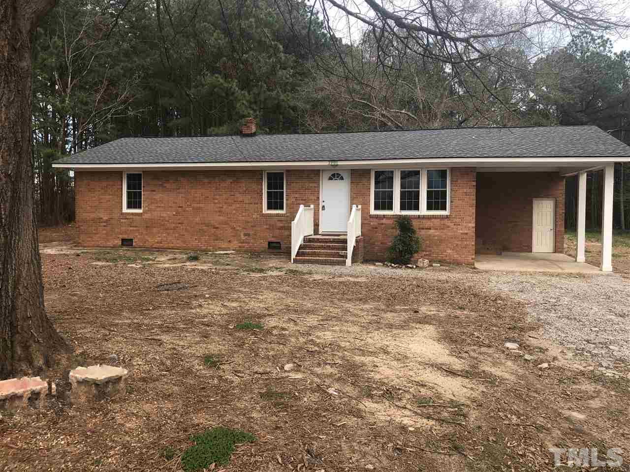 2900 Alron Road Wendell, NC 27591 - Photo 1 of 15 a backyard of a house with table and chairs