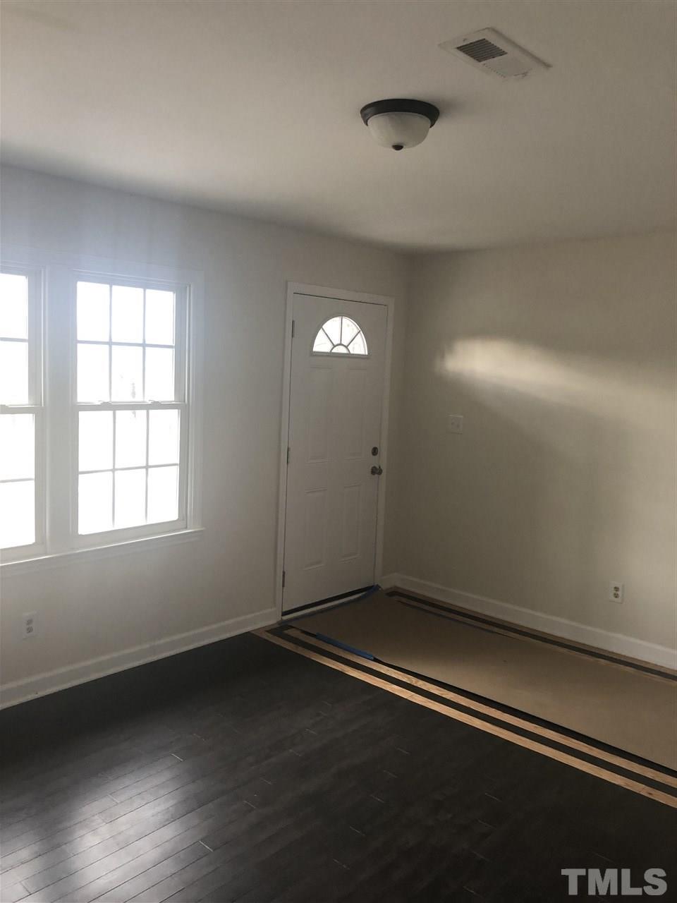 2900 Alron Road Wendell, NC 27591 - Photo 2 of 15 an empty room with a empty space and window