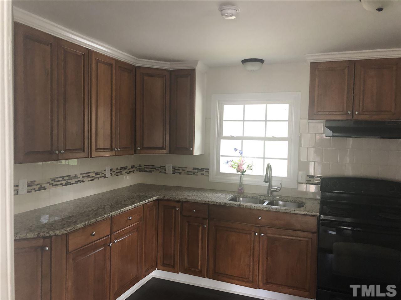 2900 Alron Road Wendell, NC 27591 - Photo 7 of 15 a kitchen with a sink and a window