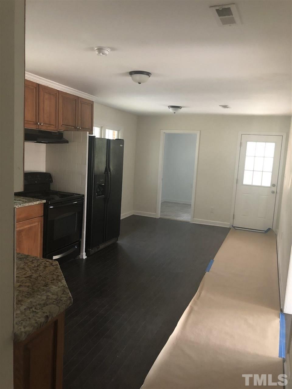 2900 Alron Road Wendell, NC 27591 - Photo 8 of 15 a kitchen with stainless steel appliances granite countertop a refrigerator a stove and a sink