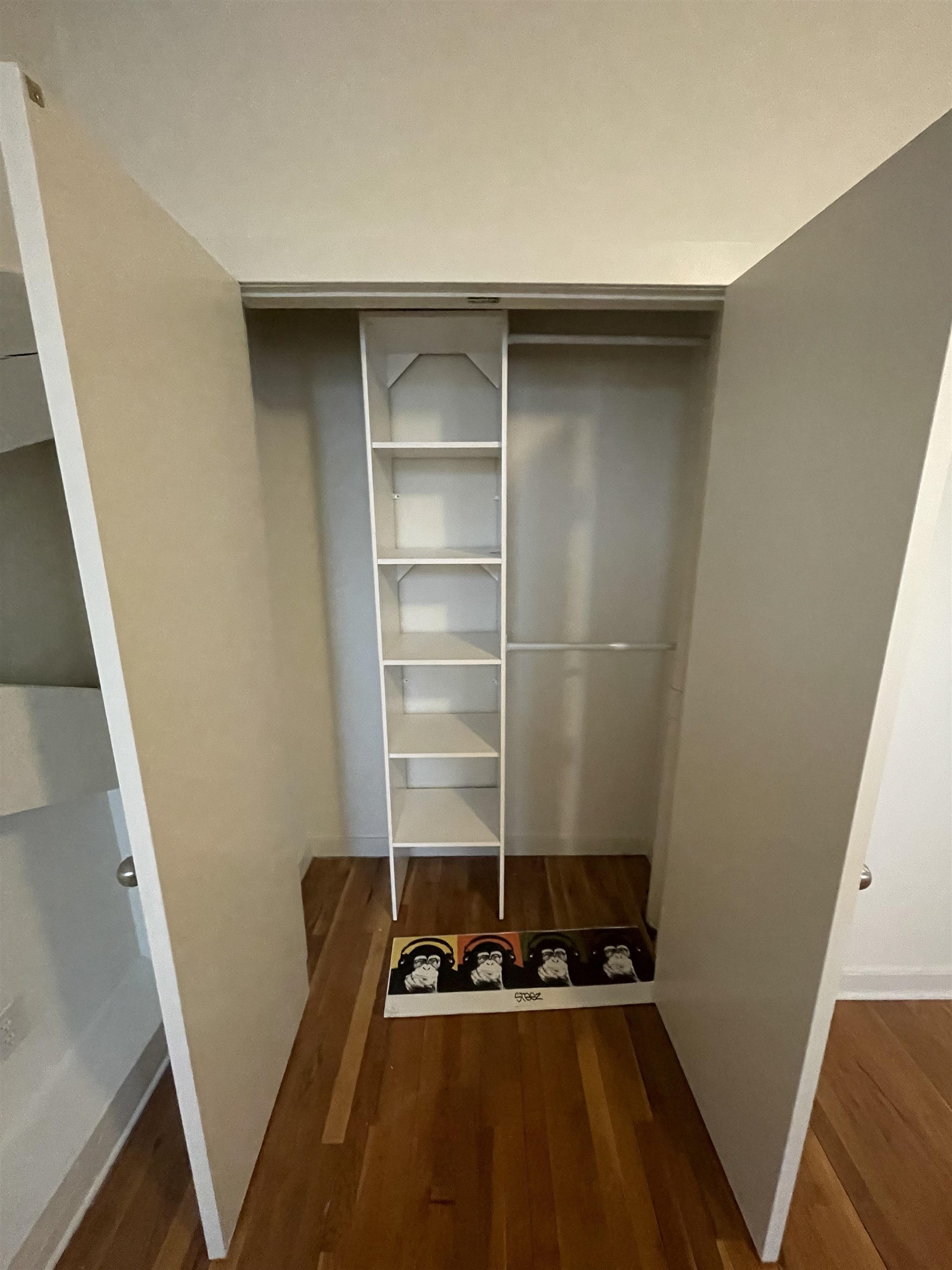 1017 Jefferson Street, Unit 321 Hoboken, NJ 07030 - Photo 9 of 10 a room with wooden floor and cabinets