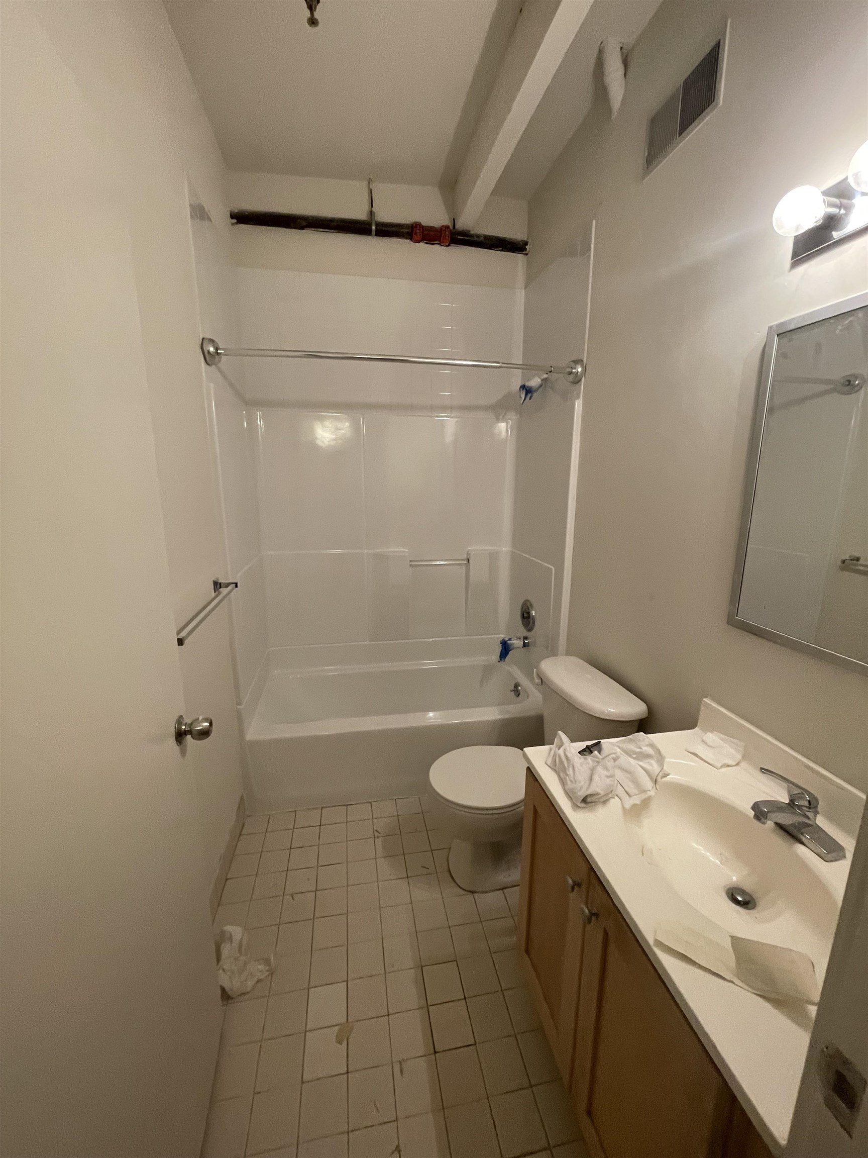 1017 Jefferson Street, Unit 321 Hoboken, NJ 07030 - Photo 10 of 10 a bathroom with a sink a toilet and shower