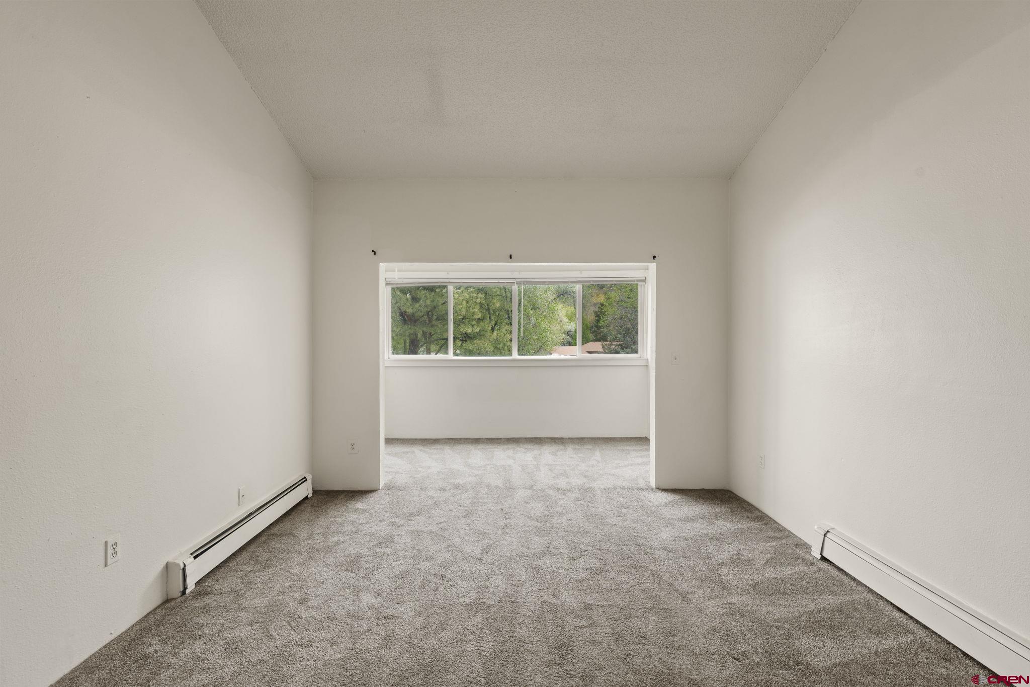 1135 Florida Road, Unit A29 Durango, CO 81301 - Photo 11 of 33 an empty room with windows