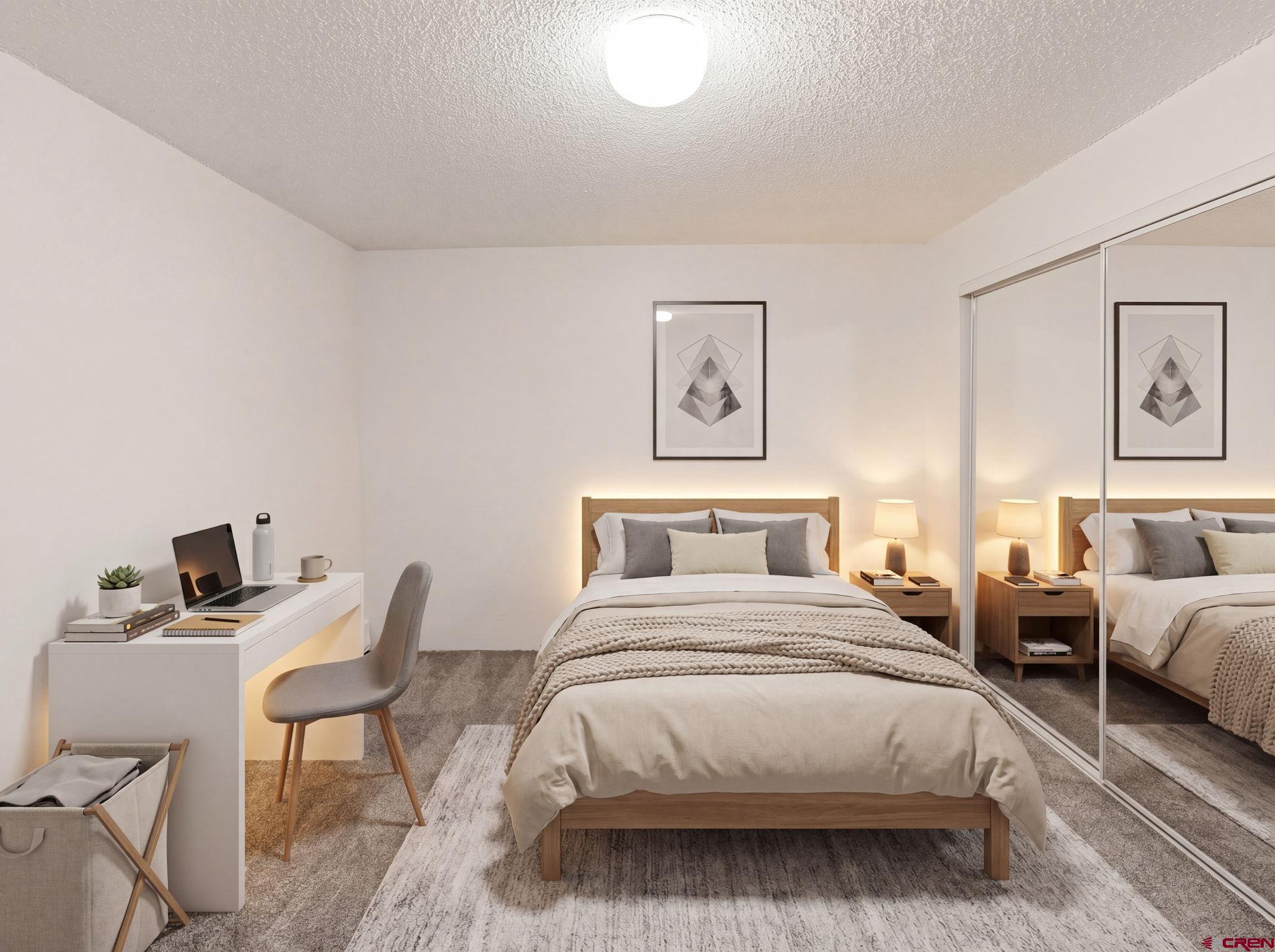 1135 Florida Road, Unit A29 Durango, CO 81301 - Photo 21 of 33 a bedroom with a bed and wooden floor