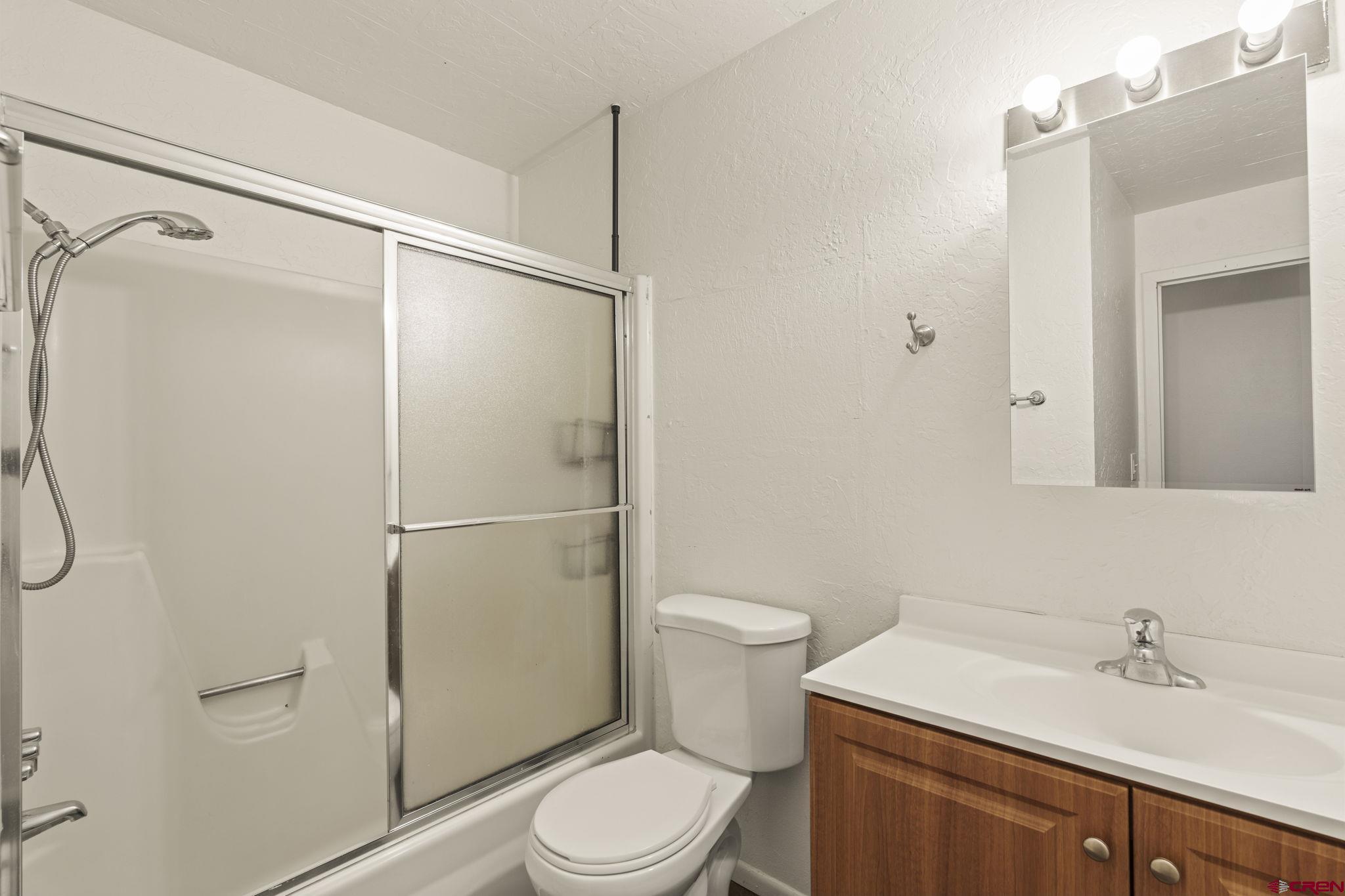 1135 Florida Road, Unit A29 Durango, CO 81301 - Photo 24 of 33 a white toilet sitting next to a bathroom sink