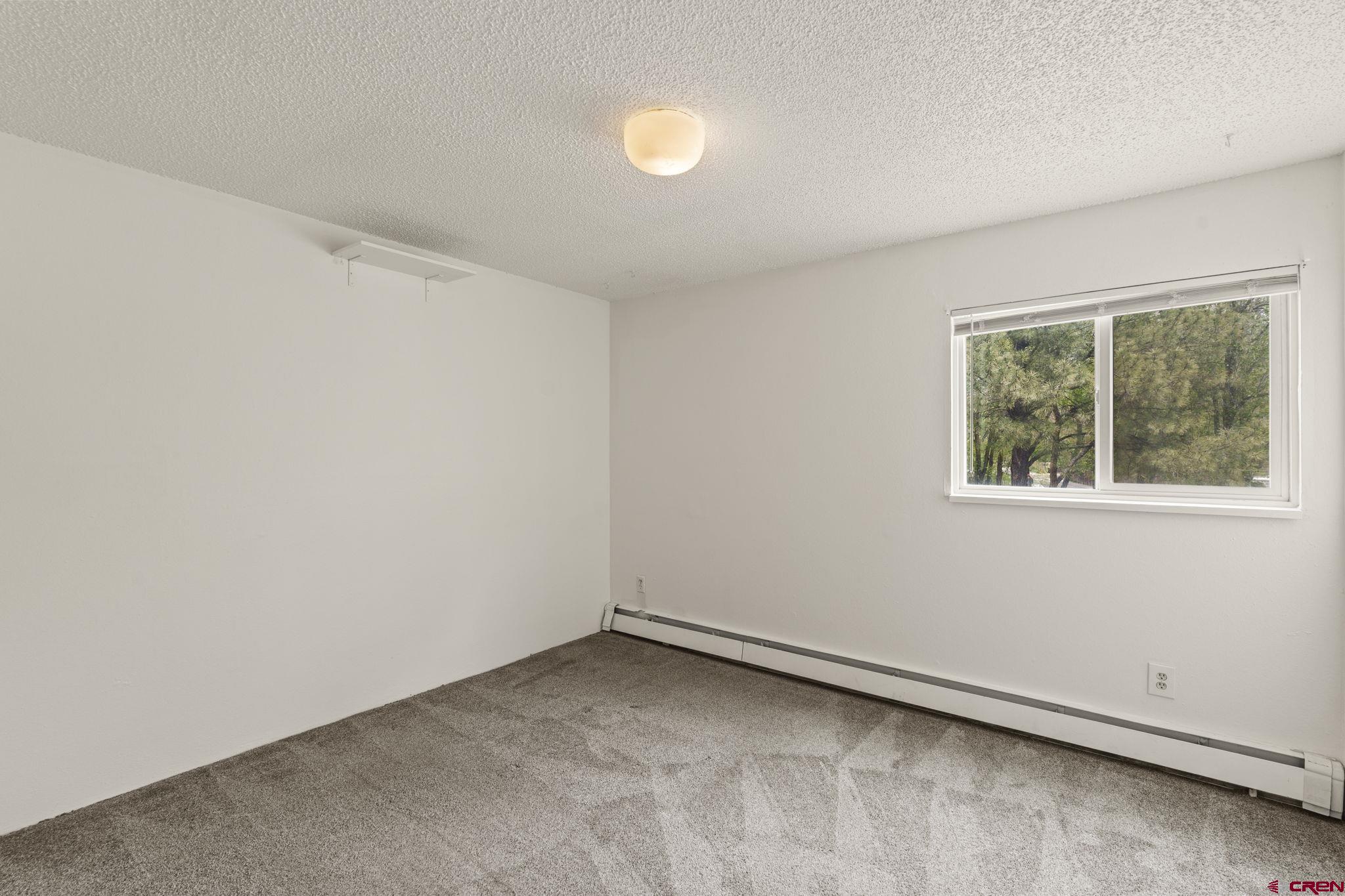 1135 Florida Road, Unit A29 Durango, CO 81301 - Photo 25 of 33 an empty room with a window