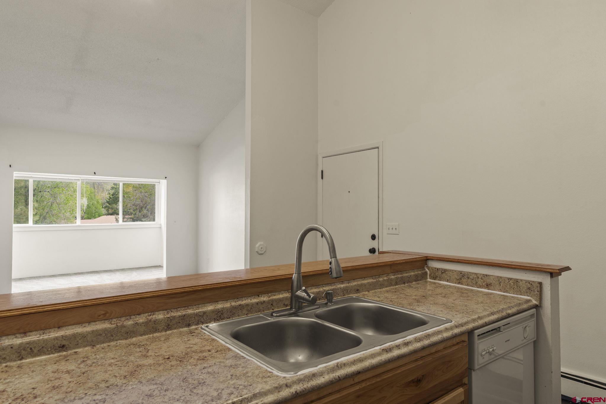 1135 Florida Road, Unit A29 Durango, CO 81301 - Photo 9 of 33 a close view of a sink and dishwasher with a window