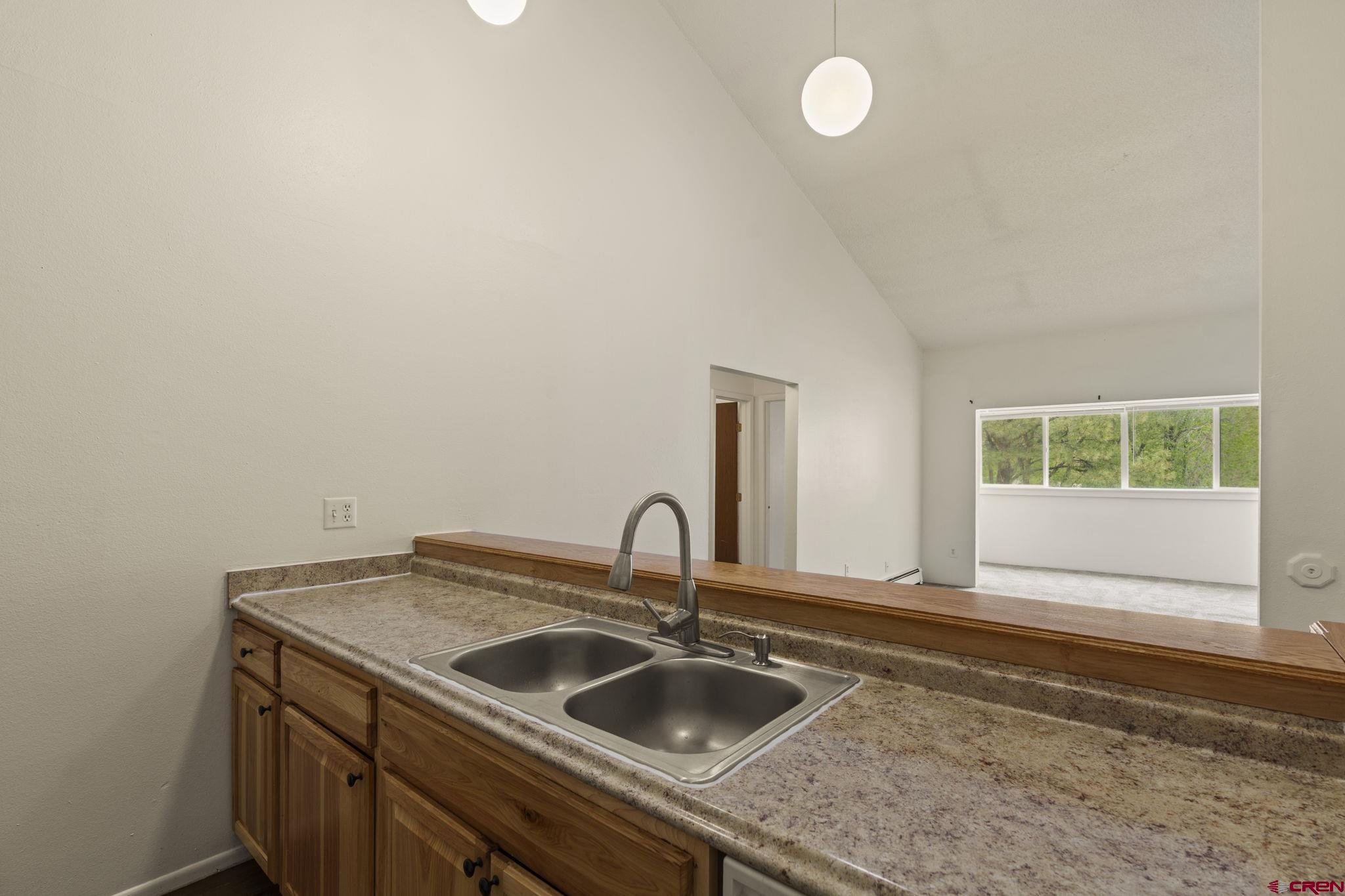 1135 Florida Road, Unit A29 Durango, CO 81301 - Photo 10 of 33 a kitchen with a sink and cabinets