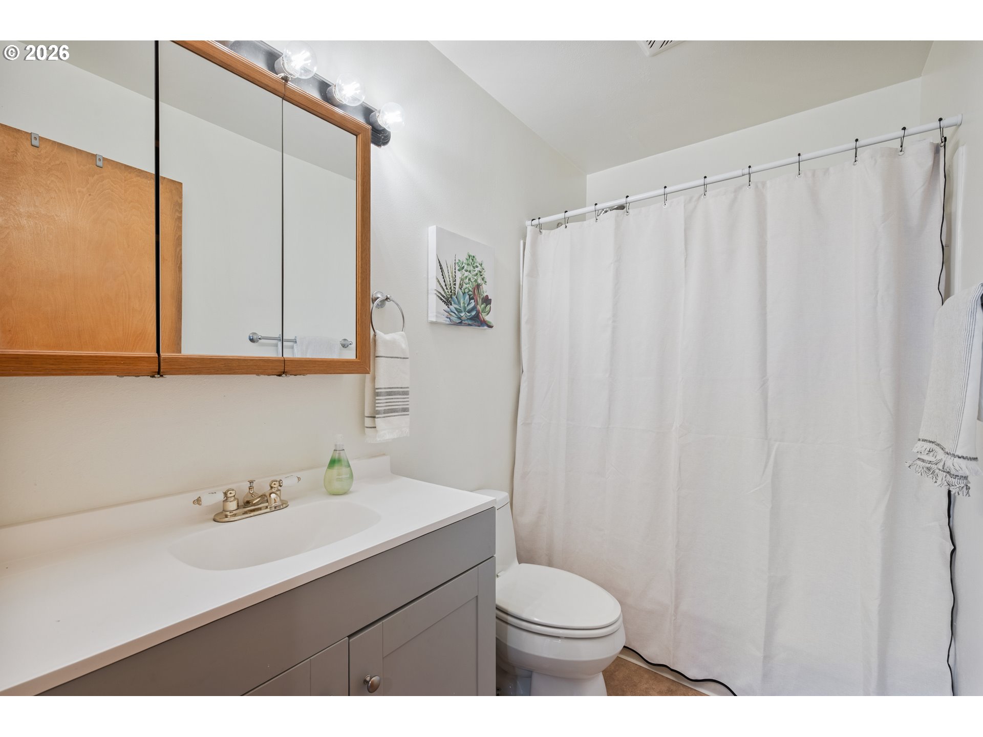 8 Terry Court Longview, WA 98632 - Photo 14 of 32 a bathroom with a sink a toilet and a mirror