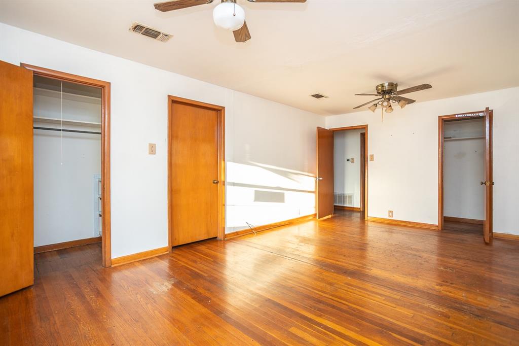 1414 Rice Avenue Gainesville, TX 76240 - Photo 14 of 21 a view of an empty room with wooden floor