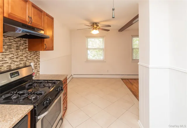 a kitchen with a stove and a refrigerator