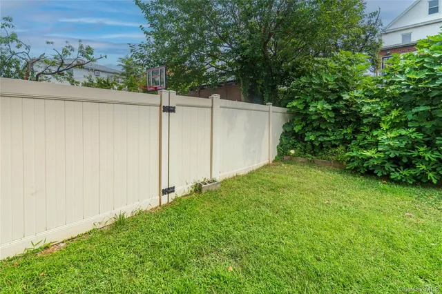 a view of a garden with sitting area