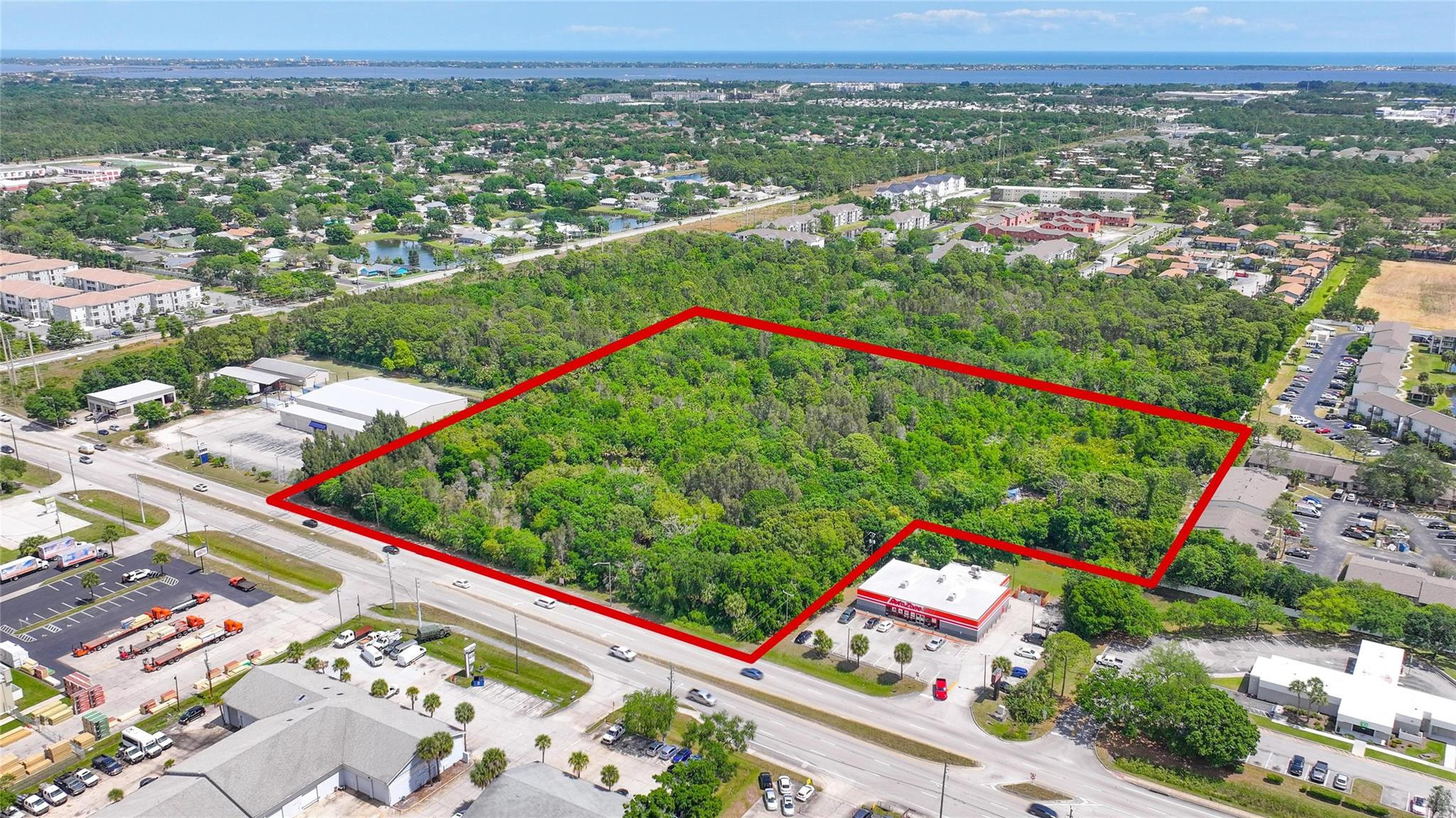 4527 South Babcock Street Palm Bay, FL 32905 - Photo 1 of 16 an aerial view of a city