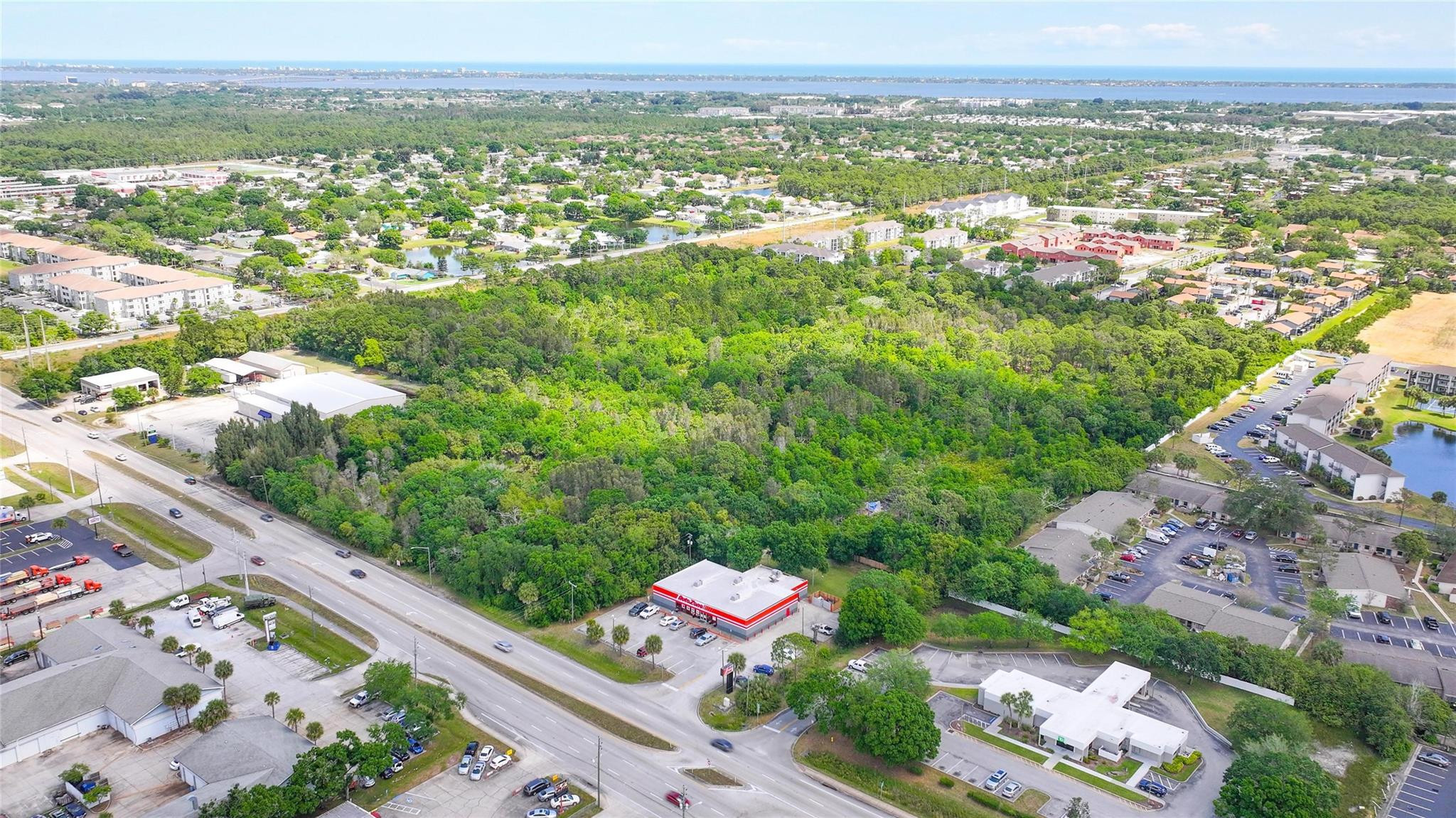 4527 South Babcock Street Palm Bay, FL 32905 - Photo 12 of 16 an aerial view of residential houses with outdoor space