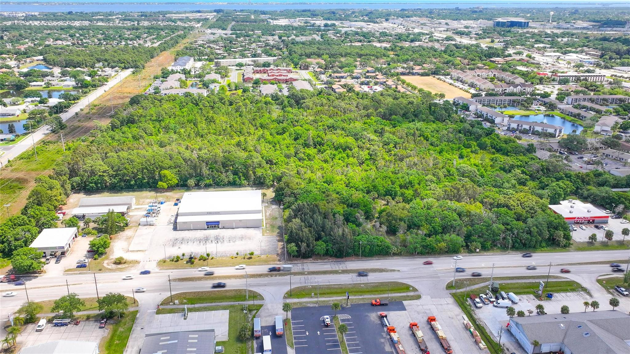 4527 South Babcock Street Palm Bay, FL 32905 - Photo 15 of 16 an aerial view of residential houses with outdoor space