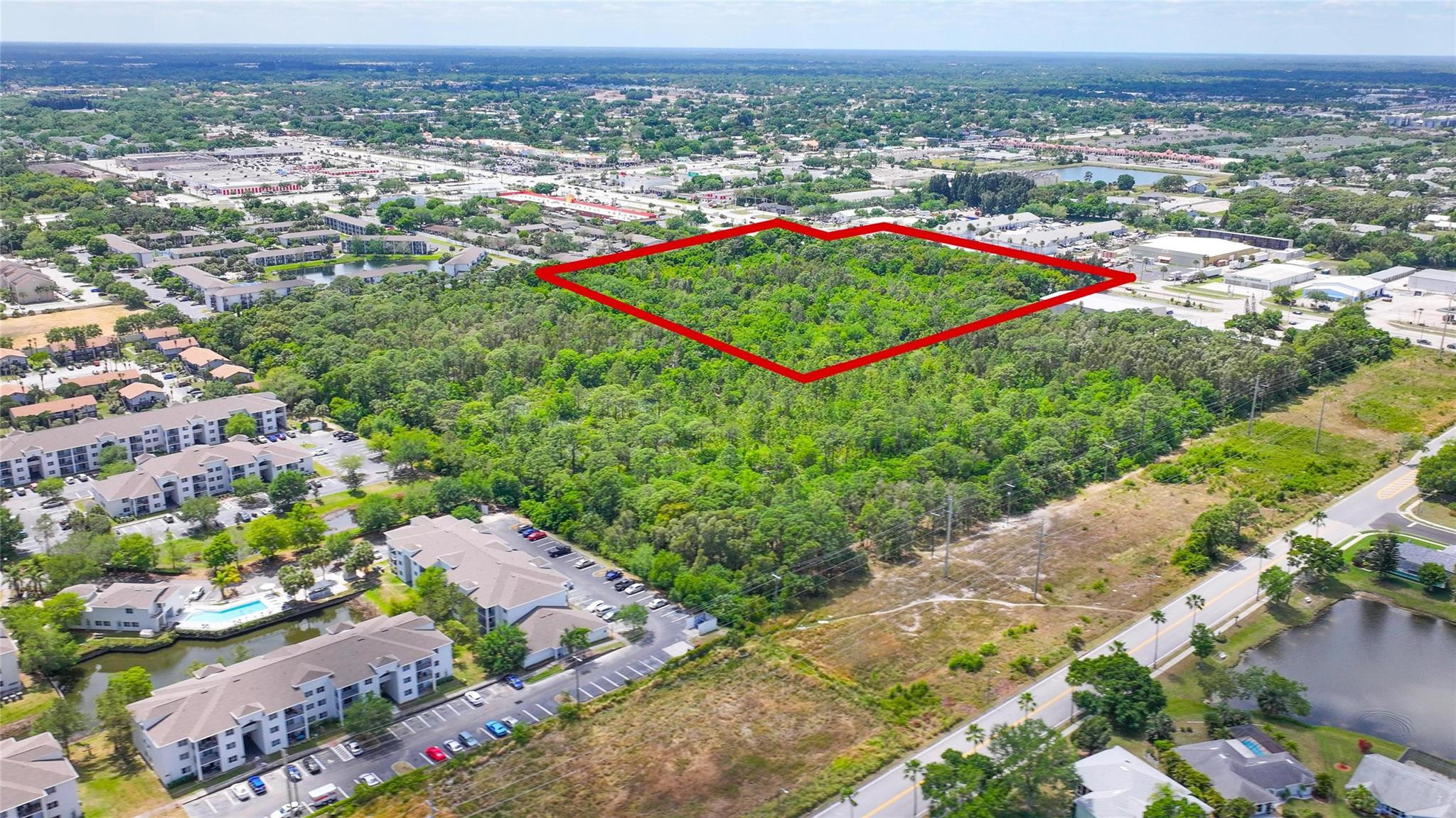 4527 South Babcock Street Palm Bay, FL 32905 - Photo 5 of 16 an aerial view of a houses with a yard