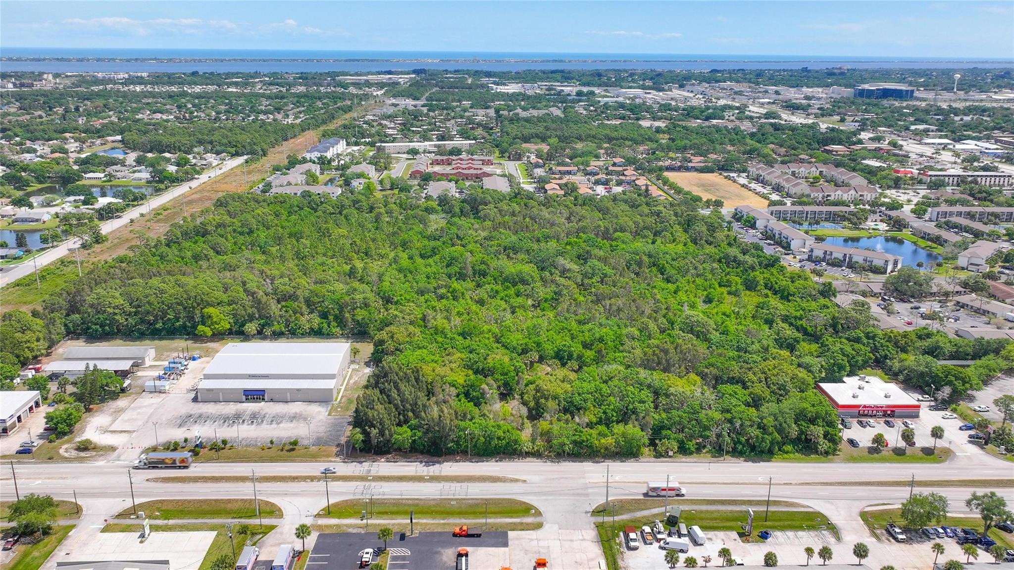 4527 South Babcock Street Palm Bay, FL 32905 - Photo 7 of 16 an aerial view of residential houses with outdoor space and swimming pool