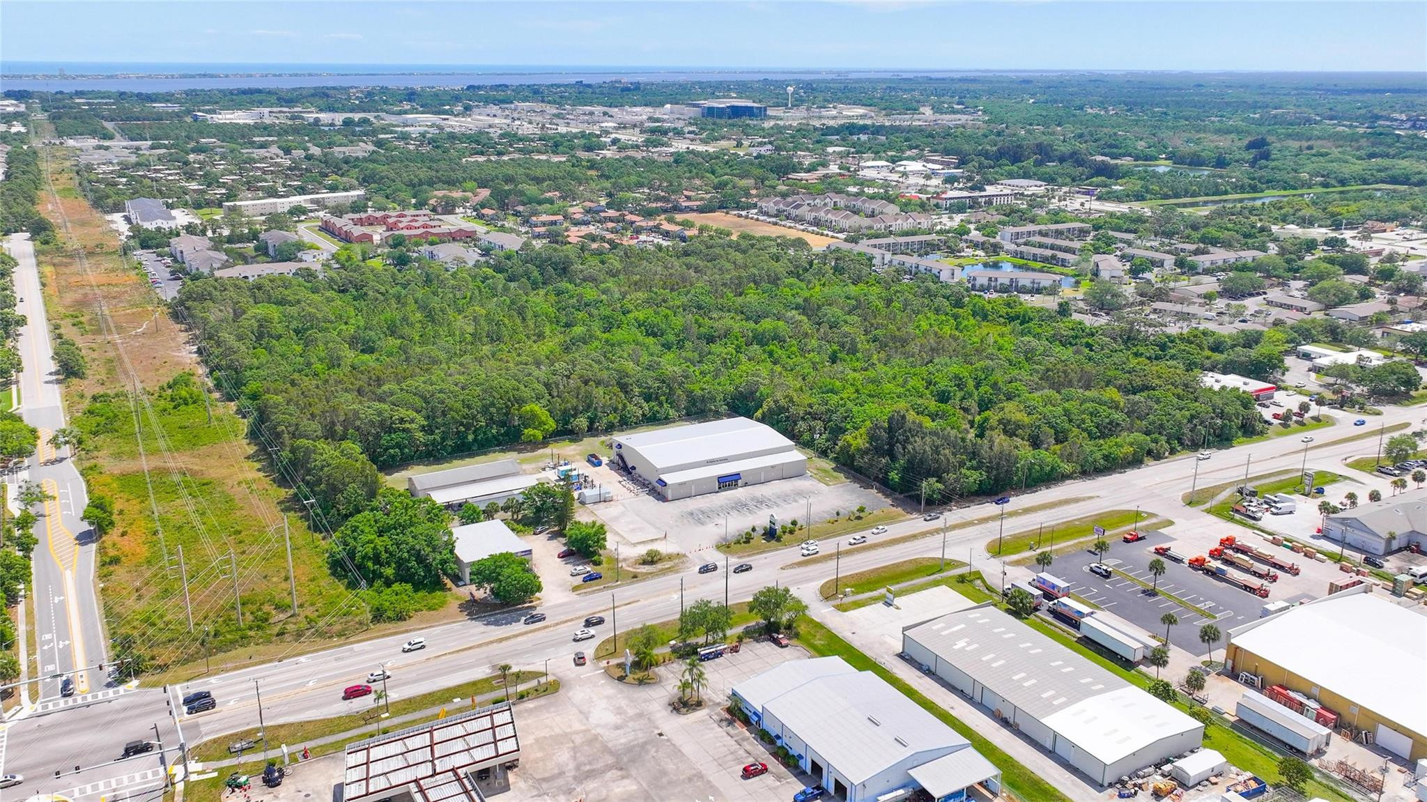 4527 South Babcock Street Palm Bay, FL 32905 - Photo 9 of 16 an aerial view of a city with lots of residential buildings