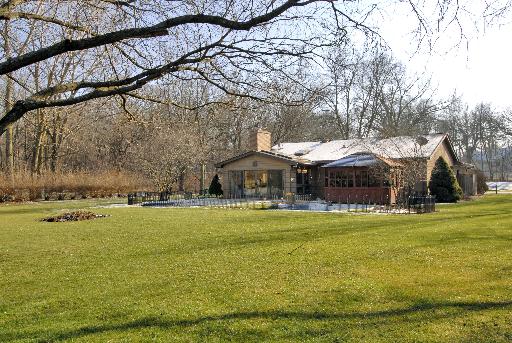 38W714 Old Homestead Road St. Charles, IL 60175 - Photo 11 of 16 a backyard of a house with lots of green space and lake view